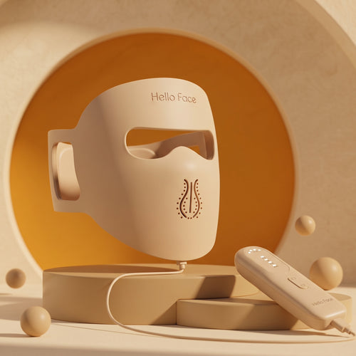 Hello Face M300 beige silicone LED mask with handheld controller in a warm studio setting